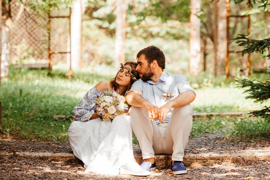 couple sitting together after unplugged wedding ceremony